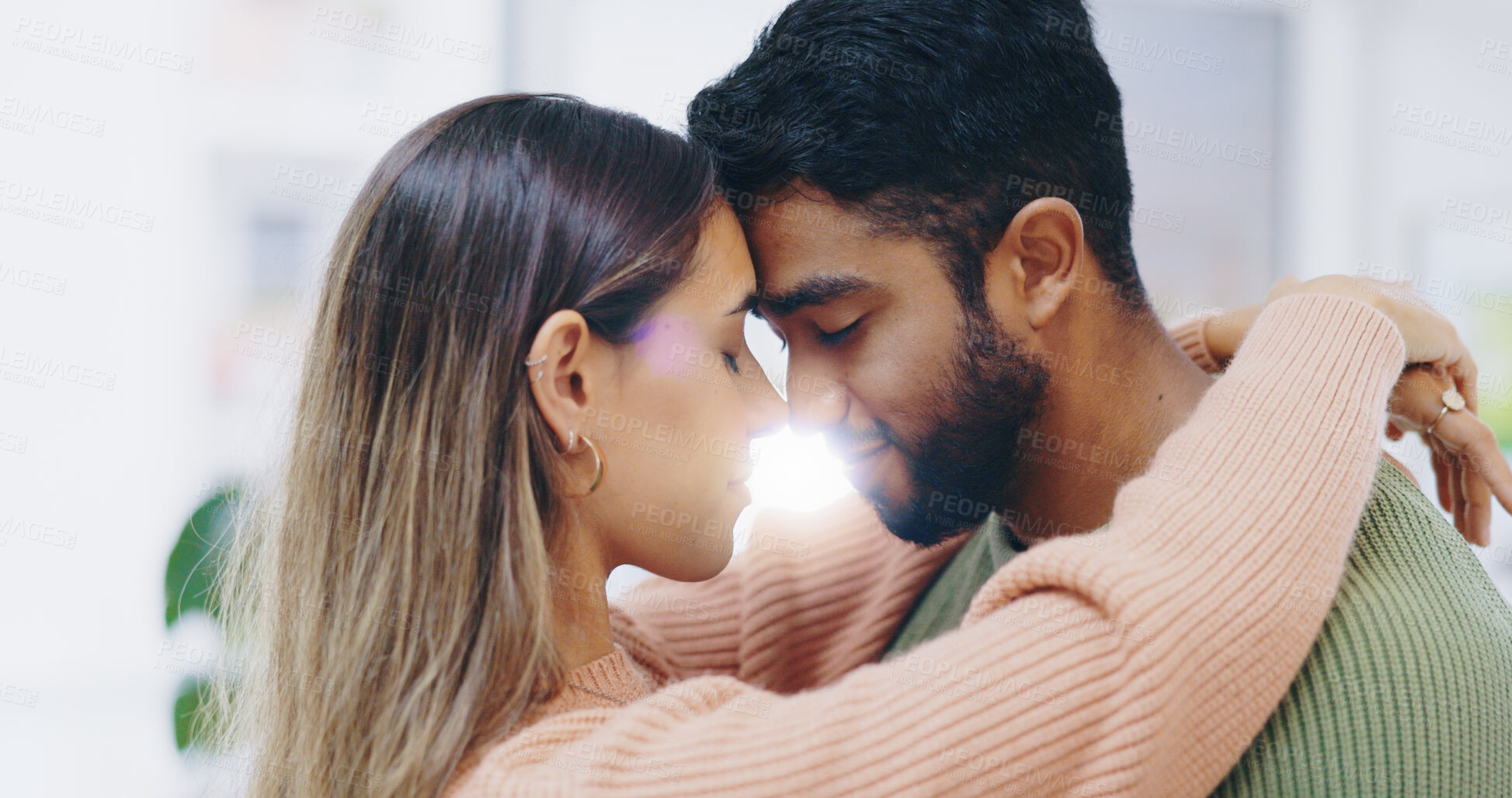 Buy stock photo Couple, forehead and hug in home for love, support and care of trust, romance and gratitude of soulmate. Face of happy man, interracial woman and together for peace, loyalty and commitment to partner