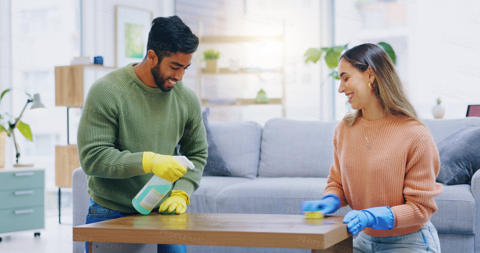 Buy stock photo Couple, spray and cleaning in home of table, furniture and disinfection of dust, dirt or risk of bacteria. Happy man, interracial woman and bottle of chemical detergent to wipe surface in living room