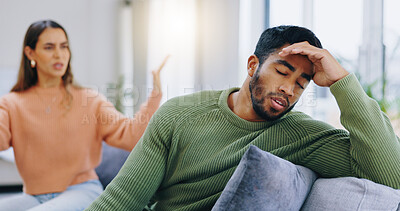 Buy stock photo Couple, home and fight on couch, sad and angry with stress, mental health and headache with relationship crisis. Man, woman and questions on lounge sofa with conflict, anxiety and mistake in marriage