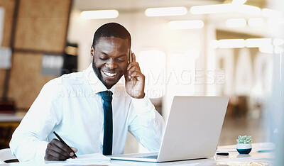 Buy stock photo Shot of a cheerful young businessman talking on his cellphone and making notes while being seated at his desk in the office during the day