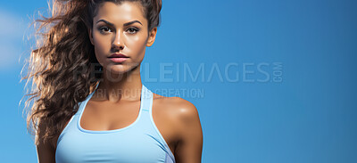 Female, portrait and fitness with blue, posing and backdrop on a studio background. Face, person and model with sport wear, mockup and athlete with simplicity, minimalistic style and looking