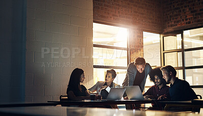 Buy stock photo Cropped shot of a group of designers having a brainstorming session in the boardroom