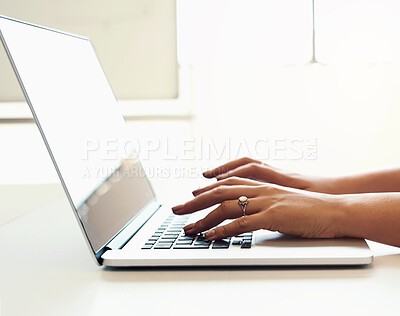Buy stock photo Shot of an unrecognizable woman using a laptop in a modern office