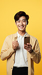 Asian man, portrait and phone for social media app, internet and website on vibrant background mockup. Face, smile and happy gen z person with mobile technology for influencer blog post in studio