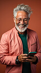 Senior man, portrait and phone for social media app, internet and website on color background mockup. Face, smile and happy pensioner with mobile technology for influencer blog post in house with bokeh background