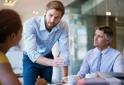 Buy stock photo Cropped shot of four businesspeople in a meeting