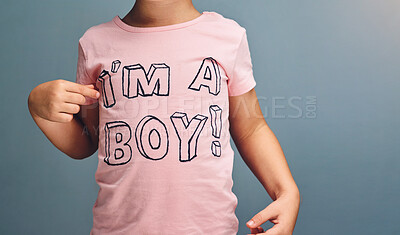 Buy stock photo Studio shot of an unrecognizable boy wearing a t shirt with “I’m a boy” printed on it against a grey background
