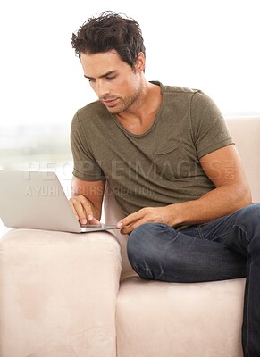 Buy stock photo Man, relax on sofa and laptop with internet, website subscription and search for movie or film streaming service at home. Freelancer or person on couch, reading online and computer for registration