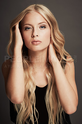 Buy stock photo Hair, beauty and face portrait of a woman with makeup, cosmetics and shine in studio. Headshot of a female aesthetic model with a skin glow, luxury haircare or hairdresser style on a grey background
