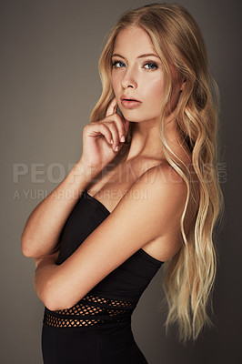 Buy stock photo Beauty, face and portrait of a woman in studio with makeup, cosmetics and long hair. Headshot of a female aesthetic model with a natural glow, sexy style and seductive pose on a grey background