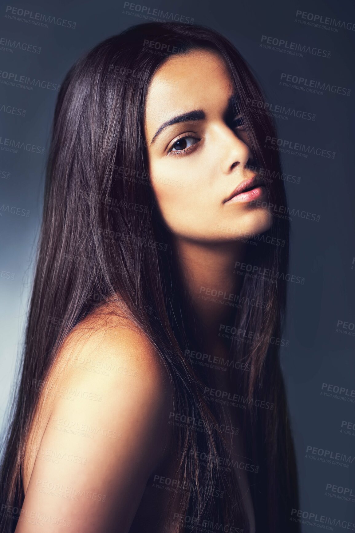 Buy stock photo Shot of a beautiful young woman in the studio