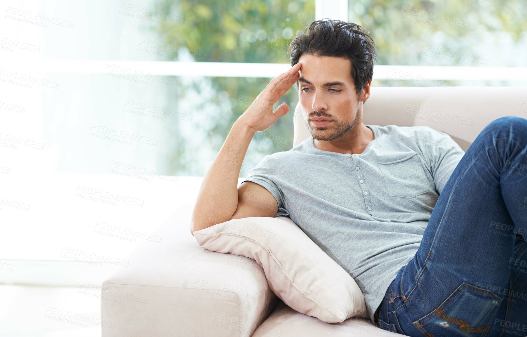 Buy stock photo Man, thinking and sofa for unhappy in home or lonely grief mourning, broken heart or stress. Male person, sad thoughts on couch for depressed risk or loss problem from anxiety, mental health or fail
