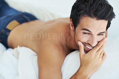 Buy stock photo Smile, relax and thinking with a shirtless man on a bed in his home to enjoy free time on the weekend. Idea, wellness and body with a happy young person in the bedroom of his apartment in the morning