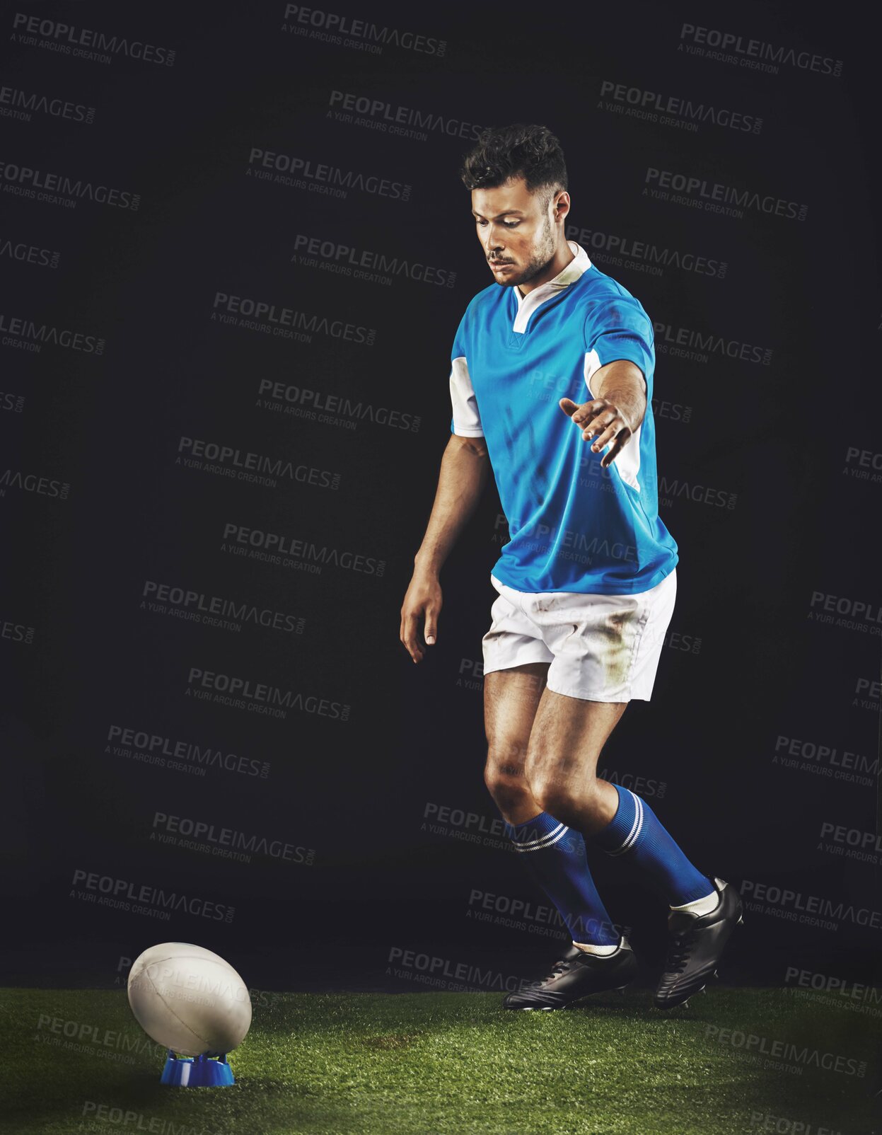 Buy stock photo Full length studio shot of a young rugby player on the field