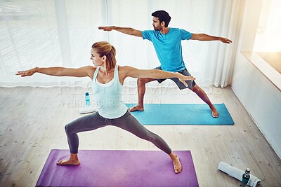 Buy stock photo Couple, yoga and stretching in home or studio fitness, exercise and holistic training, teamwork or training. People or personal trainer in warrior pose for balance, mindfulness and workout together