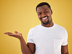 Man, portrait and smile or palm in studio on yellow background, mockup space for choice information. Black person, face with open hand gesture for decision show launch, promo deal or offer opinion