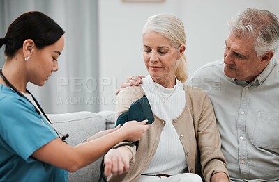 Buy stock photo Blood pressure, senior couple and nurse on a nursing home sofa for health and wellness check. Healthcare, doctor and living room consultation for medical test in retirement on a lounge couch