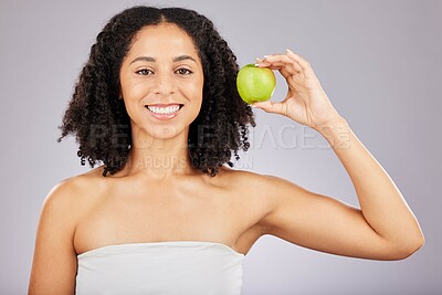 Buy stock photo Apple, fruit and portrait of a black woman holding wellness food for detox and weight loss. Skincare, beauty and young model in a isolated studio for nutrition and vitamin diet for skin glow 
