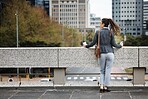 Business woman, city rooftop and thinking with ideas, vision and planning for future, career or life goal. Female entrepreneur, dream and brainstorming with choice, decision or mindset in metro cbd