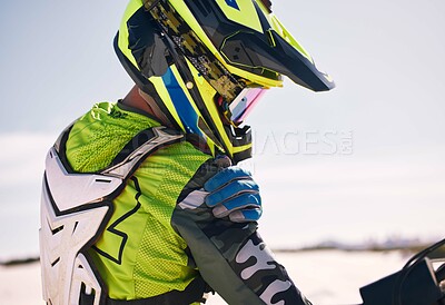 Buy stock photo Race, injury and a man on a bike on sand for a competition, travel or arm pain in sport. Accident, tired and a person or professional driver in the desert with an emergency or shoulder inflammation