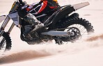 Sports, speed and person on motorbike in desert for training, workout and challenge on sand. Extreme transport, travel and cyclist with motorcycle in action for adventure, freedom and adrenaline