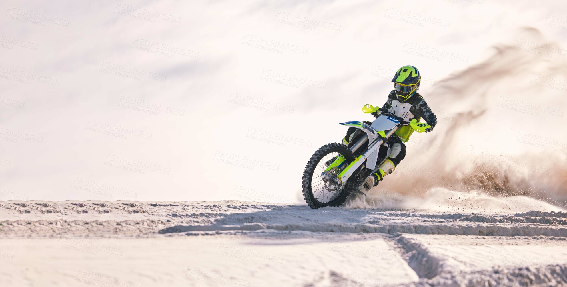 Buy stock photo Bike, dust and mockup with a sports man riding a vehicle in the desert for adventure or adrenaline. Motorcycle, space and training at speed with an athlete outdoor in nature for freedom or power