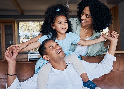 Buy stock photo Family, parents and child, happiness and bonding with girl on dad shoulders at home, love and trust with care. Smile, piggyback and mother, father and kid relax on couch, positivity and childhood