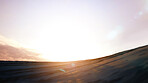 Hill, sunrise and desert dunes with patterns, blue sky or clouds in sunshine on earth. Sun, sand and background in landscape, sunset or off road terrain on the morning horizon, land or nature scenery