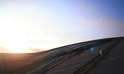 Buy stock photo Hill, sunrise and pattern of dunes with desert, blue sky and clouds in sunshine. Sun, sand and dirt track with background in landscape, sunset or off road terrain on the horizon, land or nature