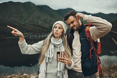 Buy stock photo Hiking, anxiety and lost couple with a phone in nature for direction, map or navigation with stress. Backpacking, travel and people with smartphone app for location search or navigation to campsite
