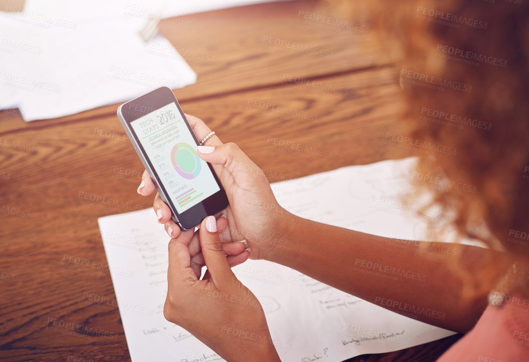 Buy stock photo Phone, hands or designer with chart for research, technology or graphs analysis on website. Reading data analytics, planning or female person working stats update on mobile app screen with paperwork