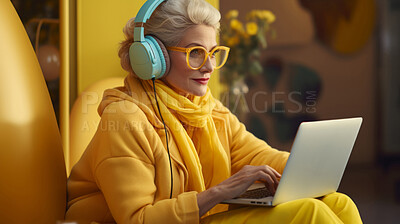 Buy stock photo Senior lady, headphones on and working on laptop in vibrant attire. Tech-savvy, focused and stylish elder in a modern setting. On a creative journey with a touch of vibrant energy.