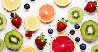 Natural, organic and mixed fruits on a white studio background for farming, produce and health diet. Colourful, fresh and sliced tropical healthy fibre food for smoothie, grocery and nutrition