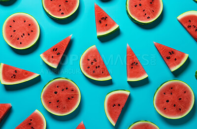 Healthy, natural and watermelon fruit on a blue background in studio for farming, produce and lifestyle. Fresh, sliced food and delicious health snack mockup for eco farm, fibre diet and agriculture