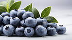 Fruit, blueberries and healthy food in studio for vegan diet, meal and green salad. Mockup, lifestyle and organic with fresh, natural and agriculture for produce, vitamins and vegetarian dinner.