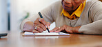 Senior woman, hands and writing agreement on contract, form or application for retirement plan or insurance at home. Closeup of elderly female person signing documents or paperwork on table at house