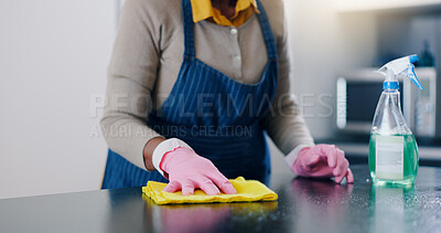 Woman, hands and cleaning table in kitchen for housekeeping, hygiene or sanitary surface at home. Closeup of female person, maid or cleaner wiping furniture for disinfection, germ or bacteria removal