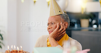 Buy stock photo Thinking, birthday and sad senior woman with depression, grief and lonely in her home. Cake, face and elderly African person alone at a party with disappointment, frustrated or annoyed in a house