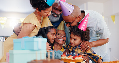 Happy black family, birthday and bonding in celebration for party, holiday or special day together at home. Excited African grandma smile with hug in unity, love or care for event, cake and candles