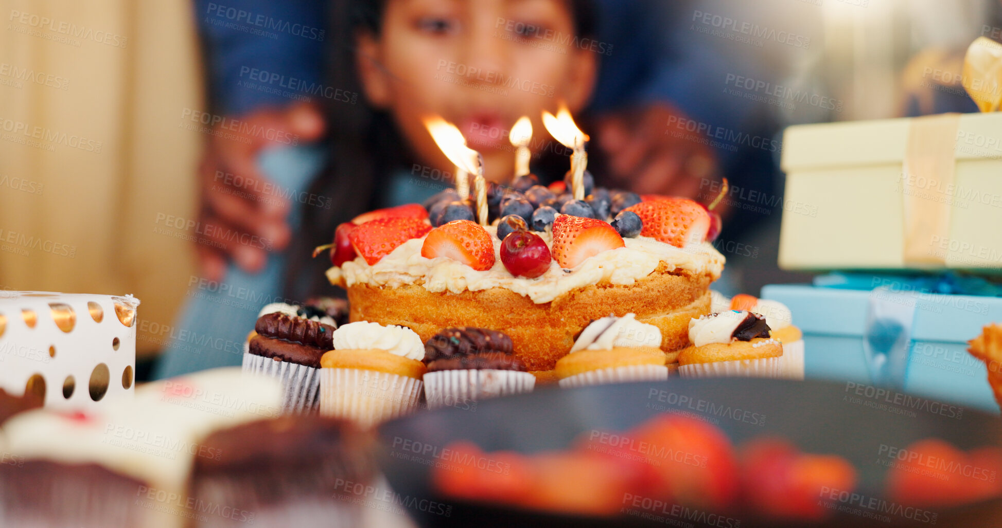 Buy stock photo Happy birthday, cake and candle light in celebration with family for party, holiday or special day at home. Closeup of little girl blowing flame for wish in growth, love or care and bonding at house