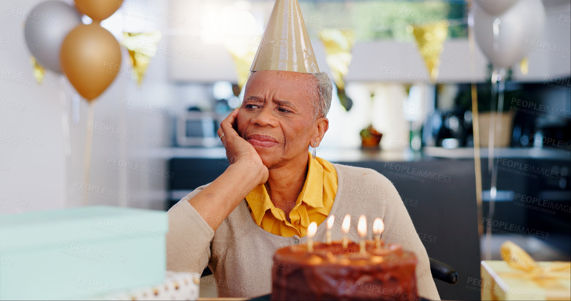 Buy stock photo Sad, birthday and senior woman thinking with depression, grief and lonely in her home. Cake, face and elderly African person alone at a party with disappointment, frustrated or annoyed in a house