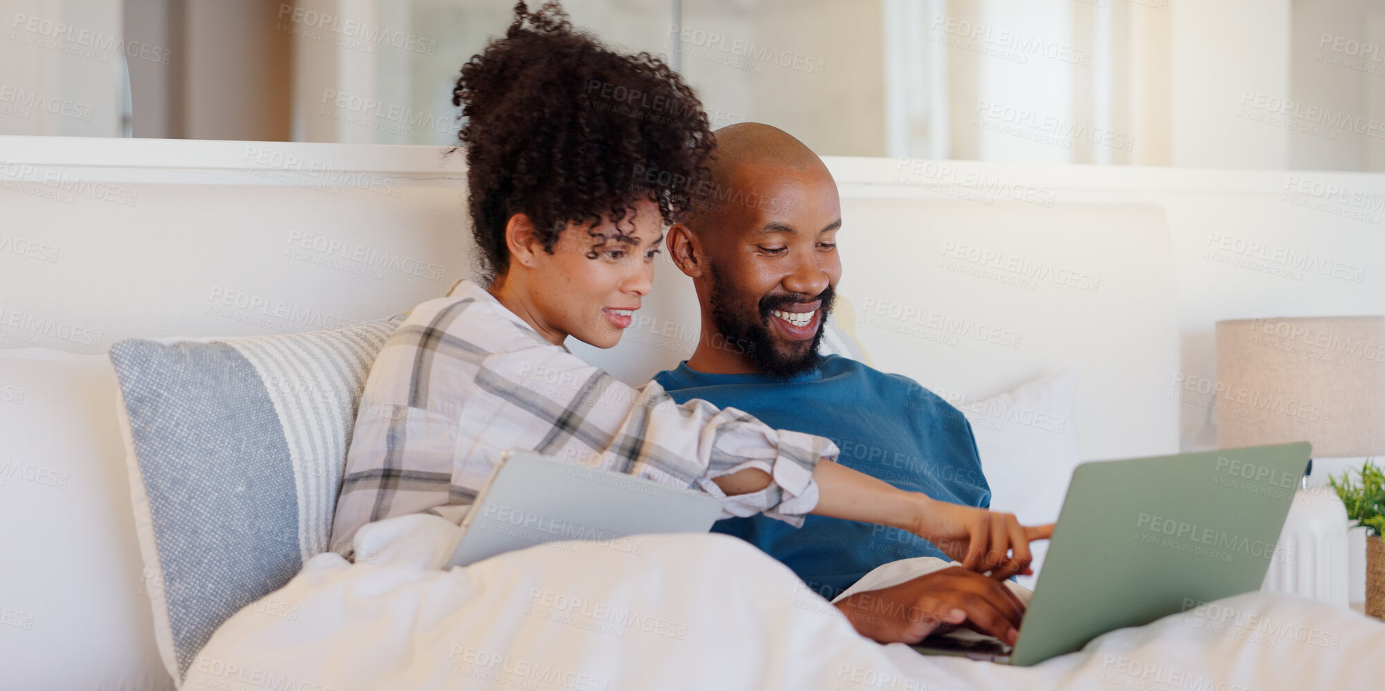 Buy stock photo Home, bed or black couple with technology, relax or smile with love, internet or streaming a movie. Bedroom, apartment or man with woman, connection or film with website for comedy, laptop or bonding