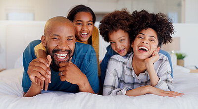 Buy stock photo Smile, portrait and children with parents in bed of modern home for bonding together with teddy bear. Happy, fun and young interracial man and woman relaxing with kids in bedroom of family house.