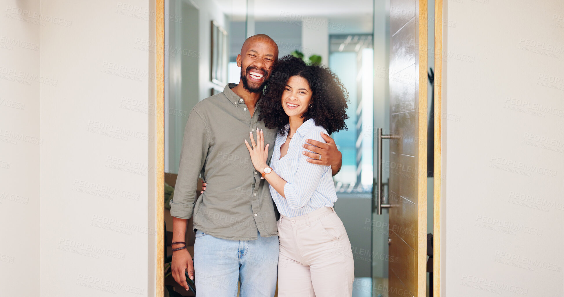 Buy stock photo African couple, happy and hug at front door in portrait with pride, care and bonding at new home. Man, woman and smile together with embrace, love and investment with property, real estate or house