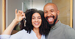 Couple, portrait and keys at front door, new home and excited with pride, care and bonding. African woman, man and happy together with embrace, love and investment with property, real estate or house