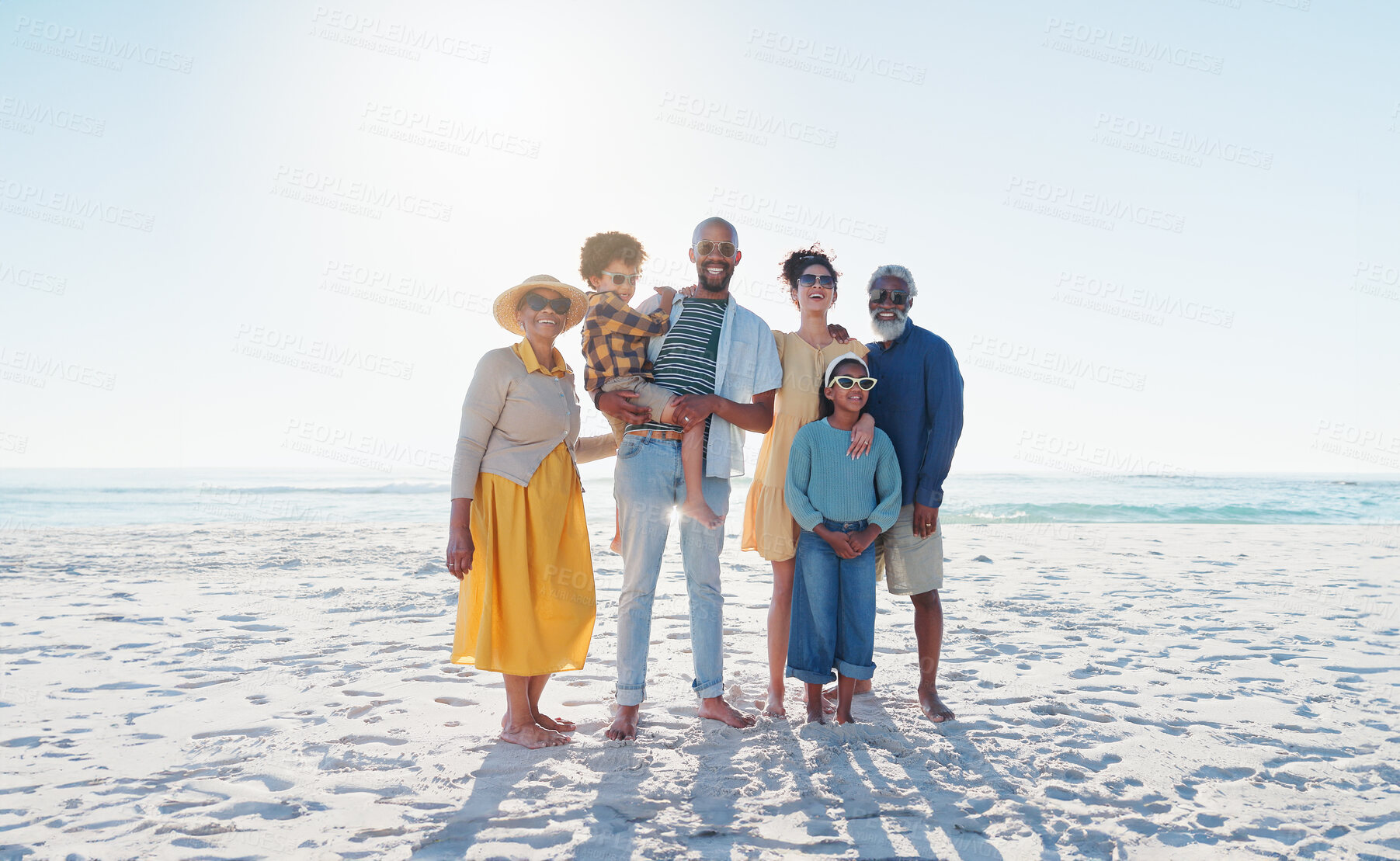 Buy stock photo Portrait, beach and family with vacation, love and smile with weekend break, getaway trip and sunshine. Summer, grandparents and mother with father, children and seaside with kids, holiday and water