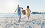 Happy parents, beach and swing child in sunshine for freedom, fun and support together on holiday, vacation and travel to Bali. Family, mom and dad lifting boy kid for jump, play and energy at ocean