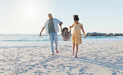 Buy stock photo Happy parents, beach and swing child in sunshine for freedom, fun and support together on holiday, vacation and travel to Bali. Family, mom and dad lifting boy kid for jump, play and energy at ocean