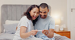 Excited couple, bed and positive pregnancy test for maternity, responsibility or family at home. Happy man and pregnant woman smile for parenthood, morning or good news or results in bedroom at house