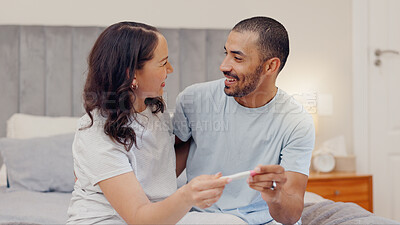 Buy stock photo Excited couple, bed and positive pregnancy test for family, start or maternity at home. Face of happy man and pregnant woman smile for parenthood, morning or good news or results in bedroom together